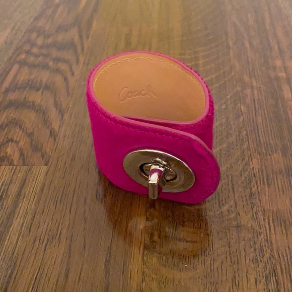 Coach hot pink hair calf wide turn lock bracelet.